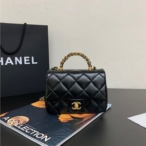 CHANEL Black Quilted Mini Bag with Gold Chain